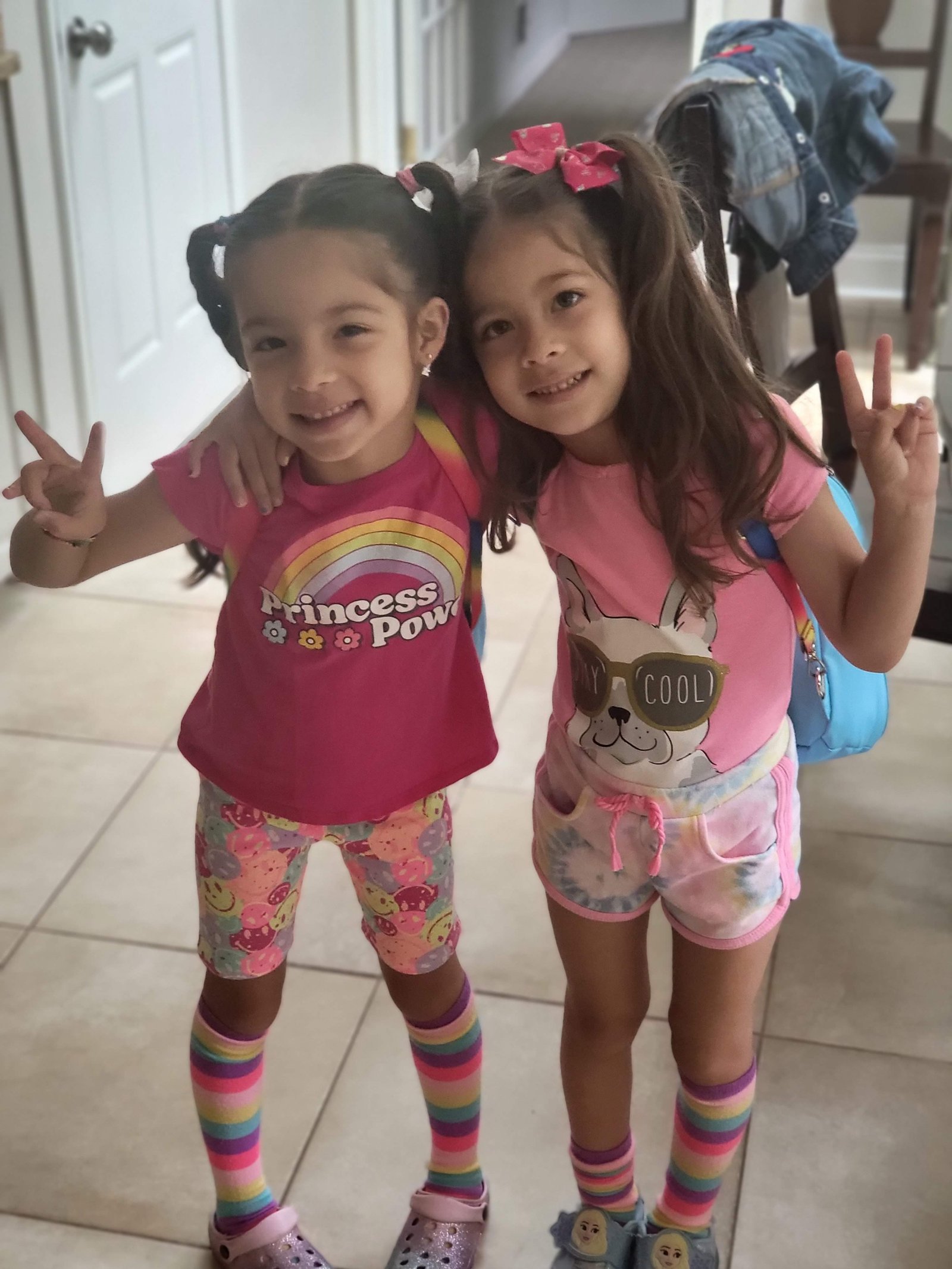 Charlie and JoJo in Princess Power shirts with backpacks in 2022