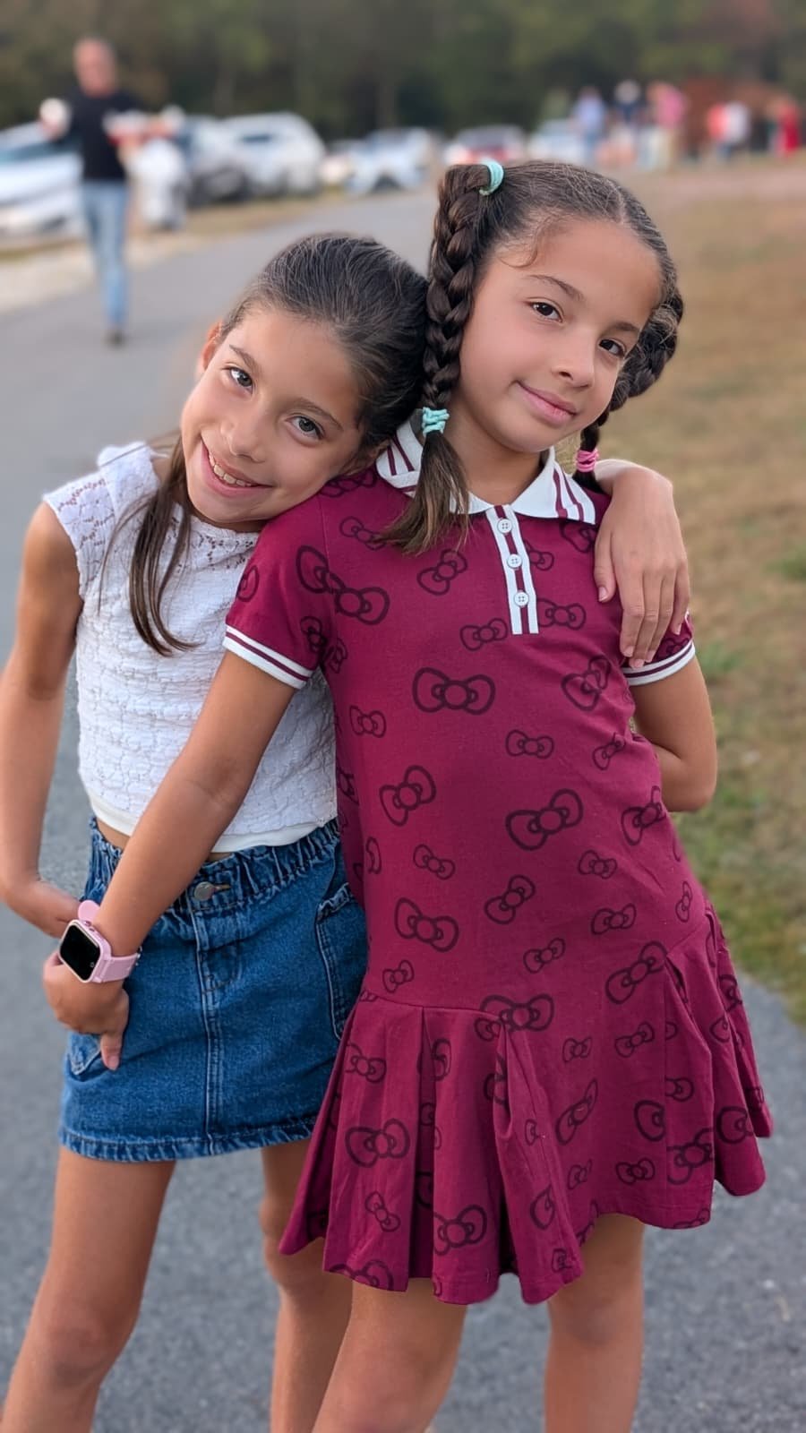 Charlie and JoJo arm in arm outdoors in 2025