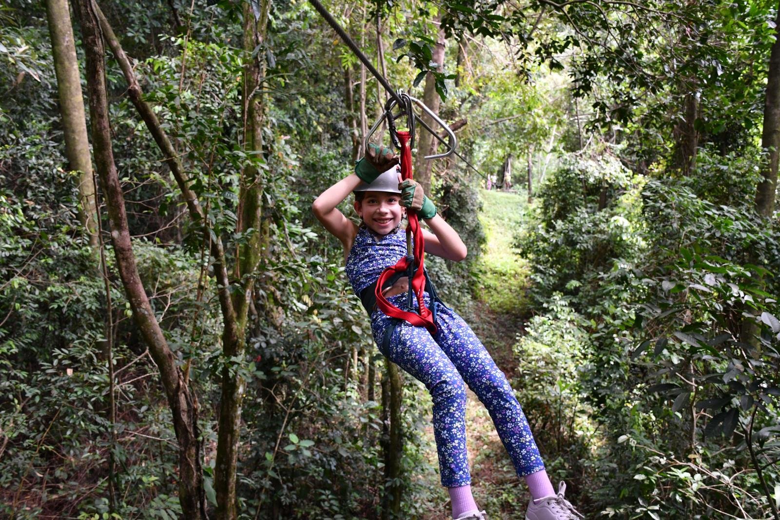 Charlie zip lining through jungle